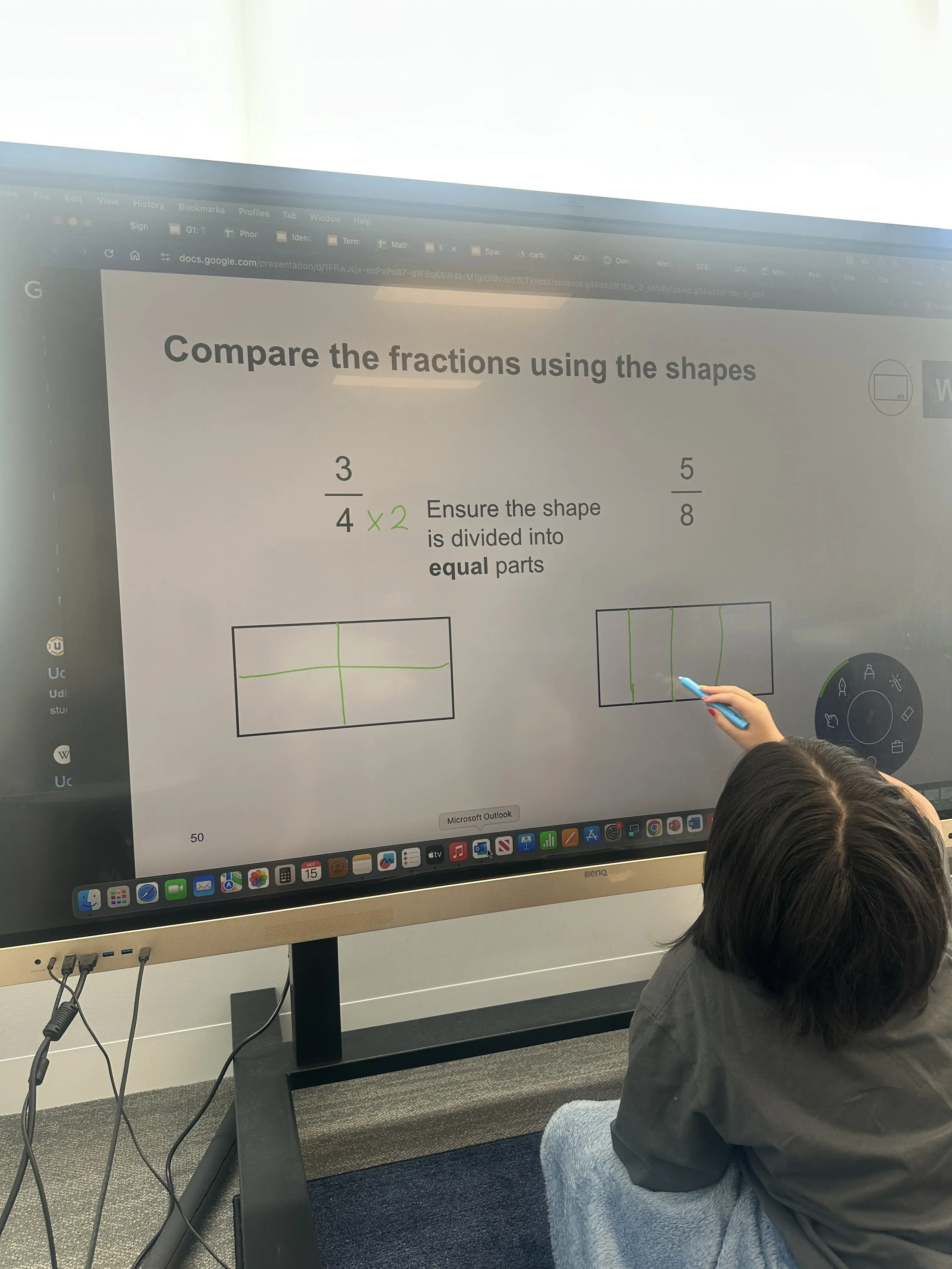 Student learning fractions with visual aids at New Era Education